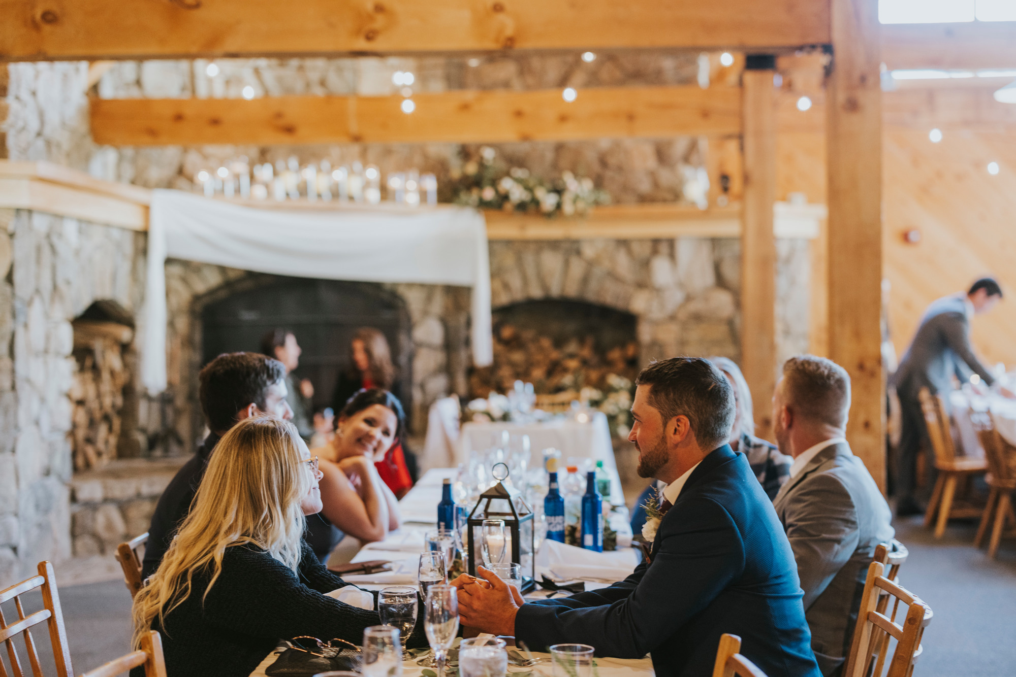 Wedding guests in the fireside room