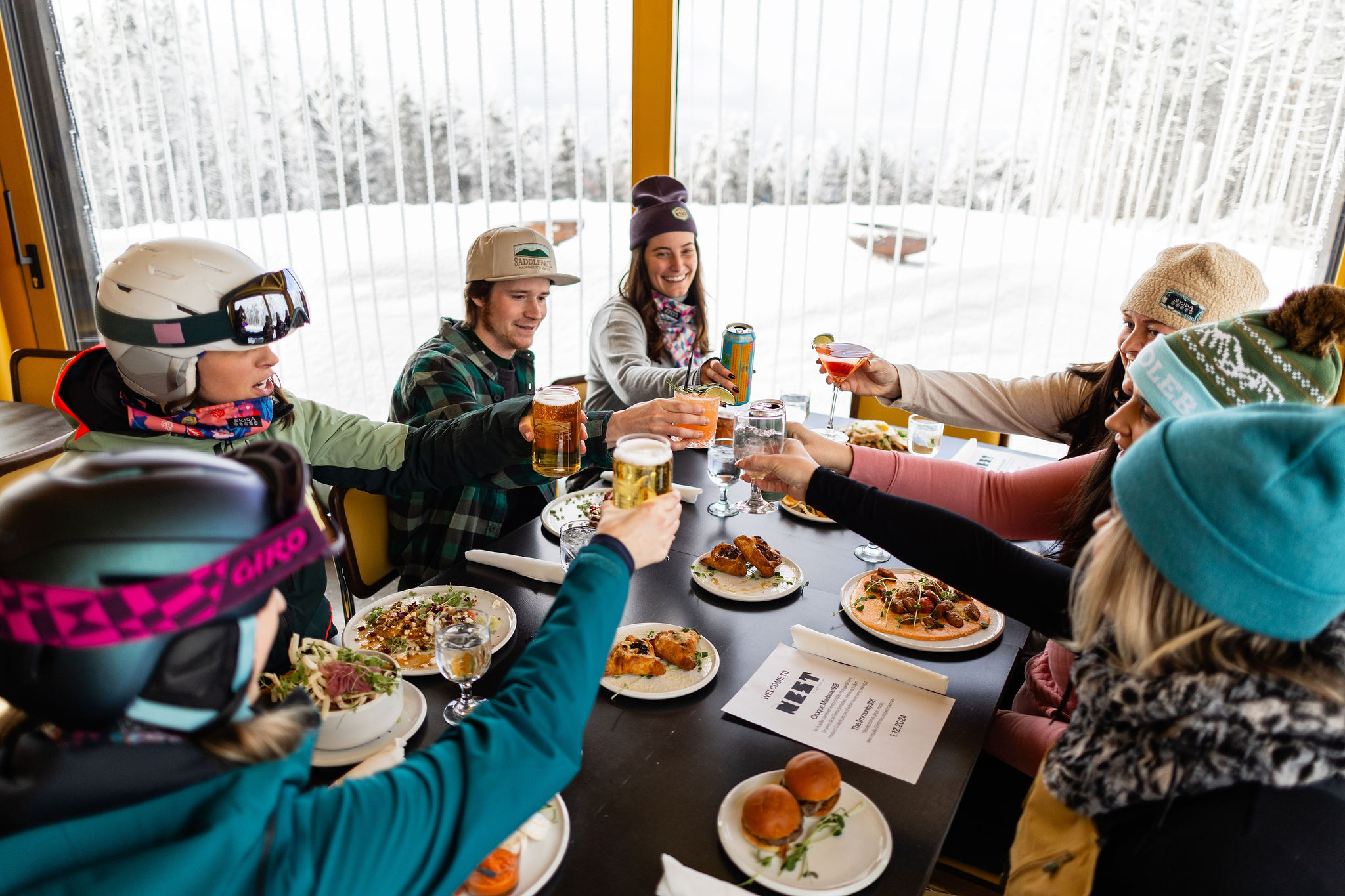 A group dining at The Nest - cheers!