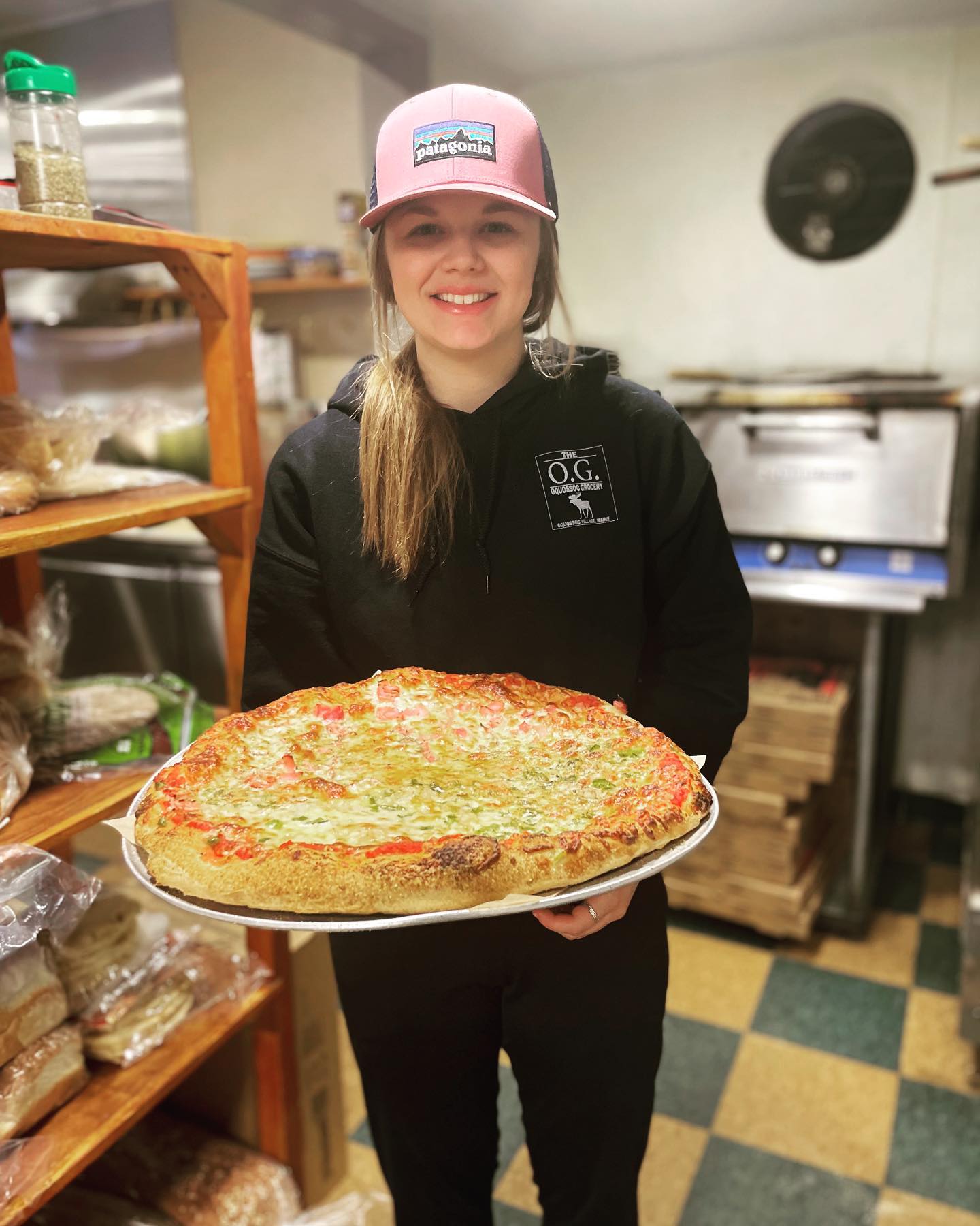 OG employee with pizza