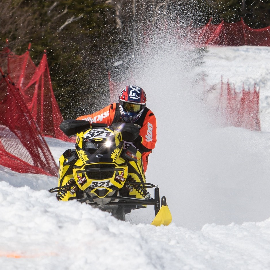 King of the Mountain snowmobile racer going up grey ghost