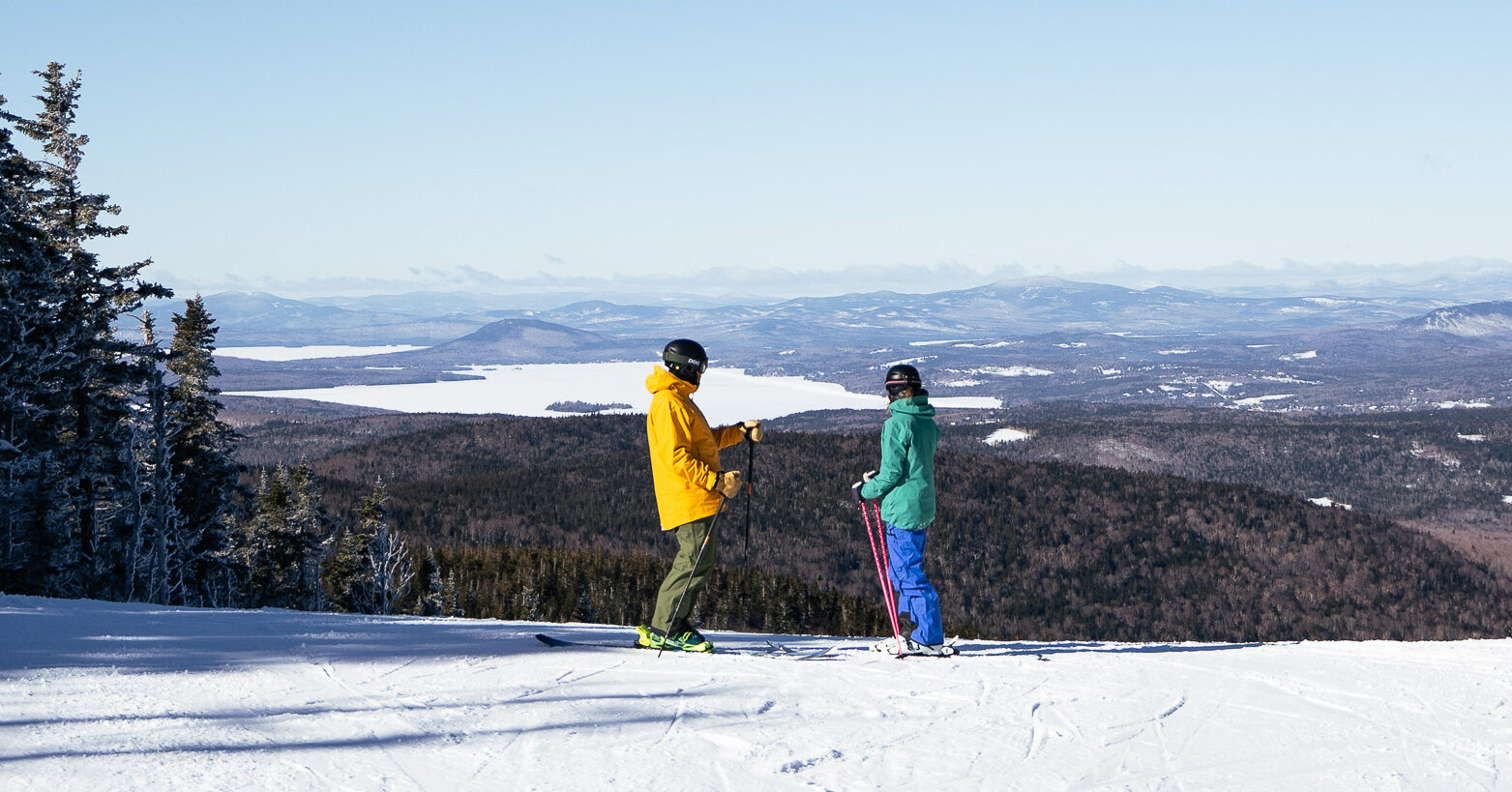 Two Skiers atop Red Devil