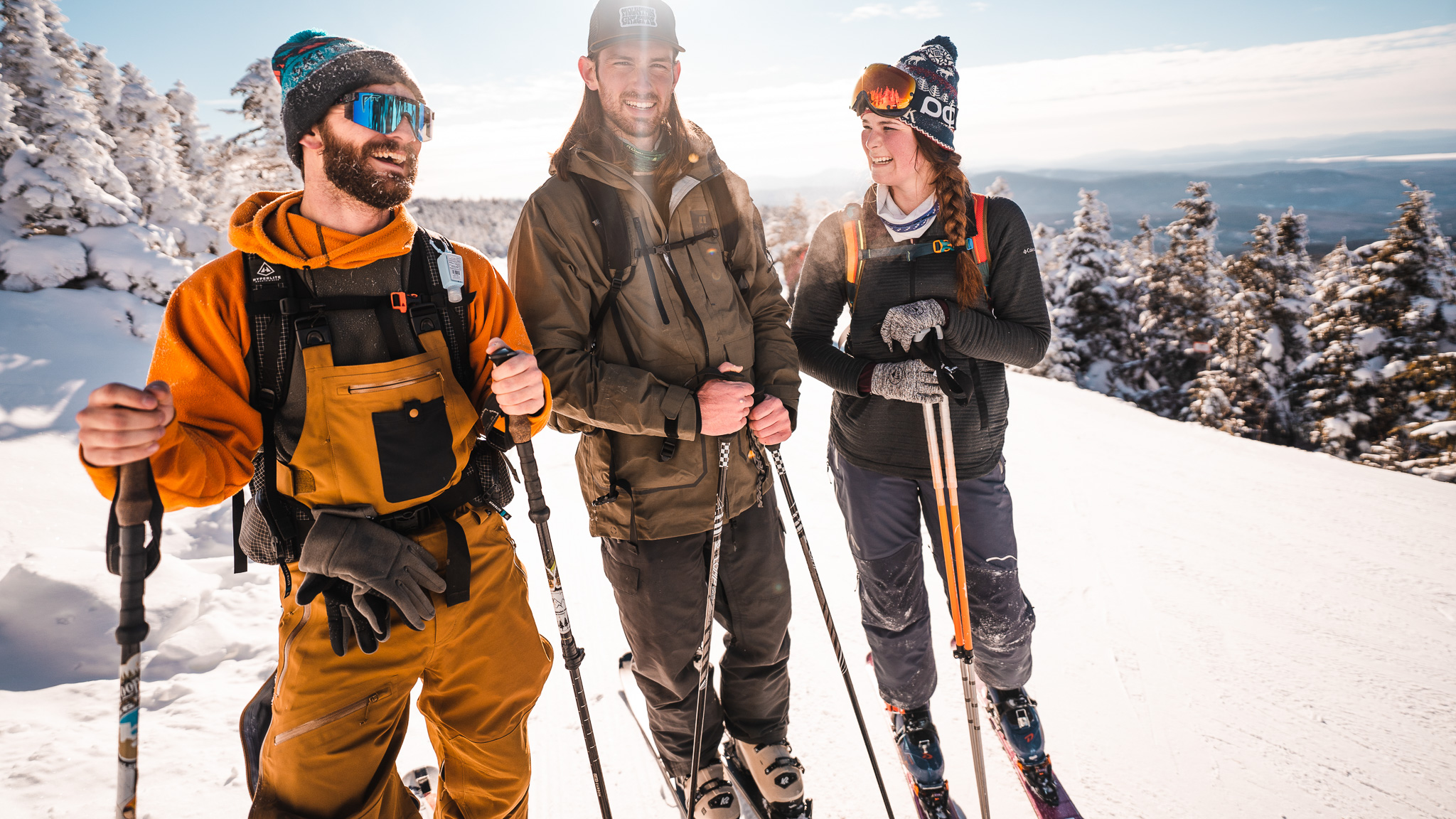 Three uphillers summitting at Saddleback