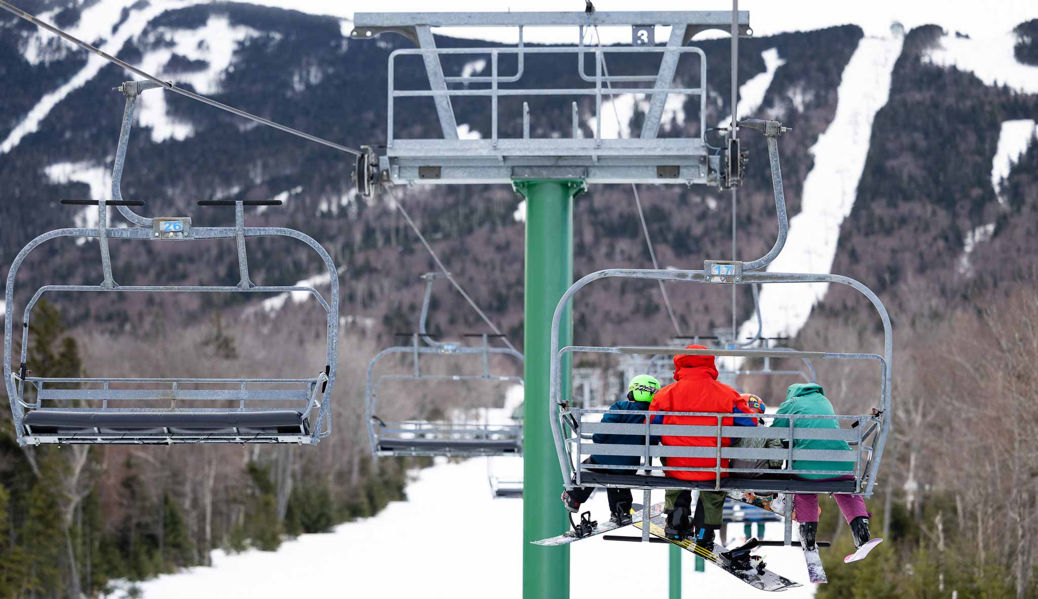 Family riding ski lift at Saddleback maine